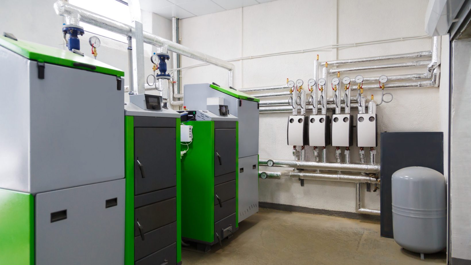 Large industrial boiler room with appliance using pallets as a fuel